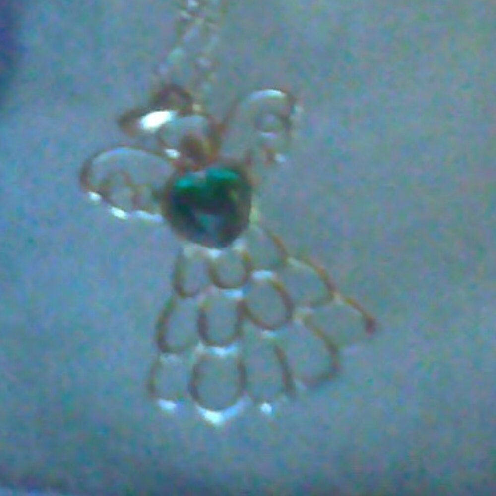 silver plated angel necklace with green stone